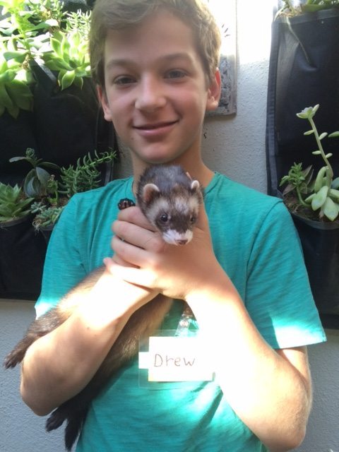 Drew Holding a Racoon